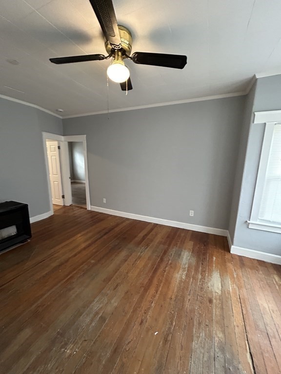 623-631 Birch Street, Unit 2 Fall River, MA 02724 - Photo 11 of 17 an empty room with wooden floor fan and windows