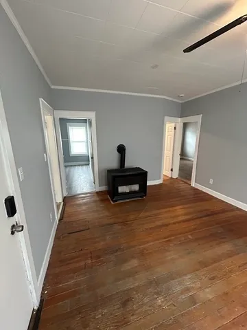 a bedroom with a bed and a mirror