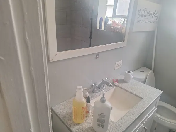 a bathroom with a sink and a mirror