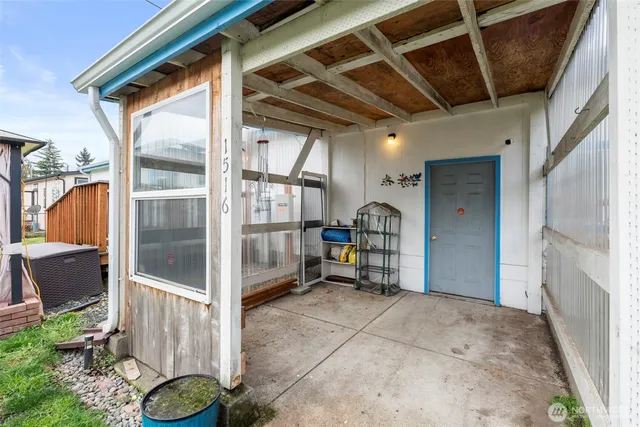 a view of a backyard with sitting area