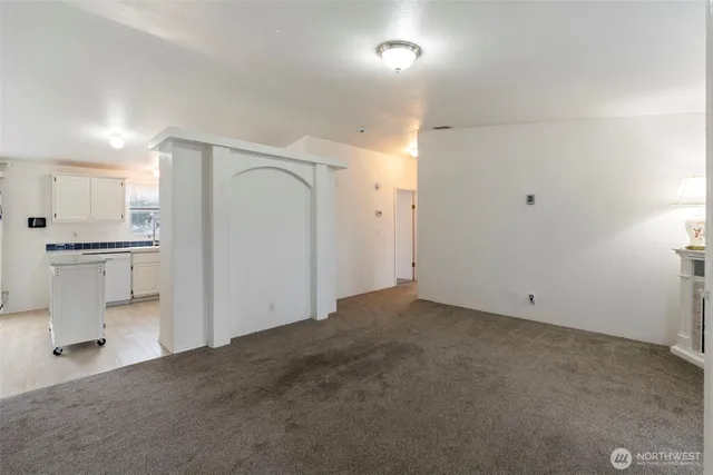 a view of a kitchen with a sink and an oven in a room