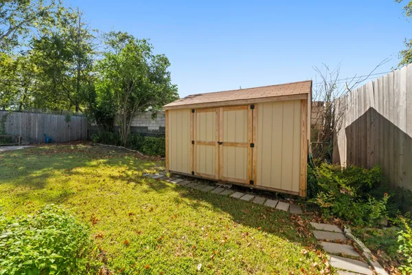 a view of backyard with potted plants
