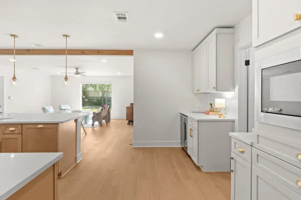a kitchen with sink cabinets and window