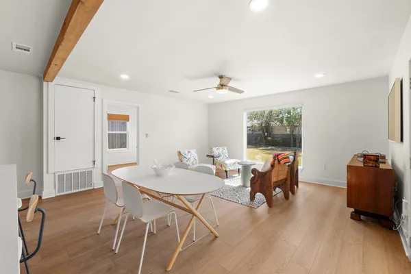 a dining room with furniture and window