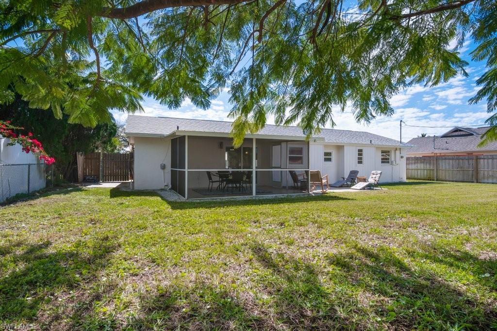 1207 Hernando Street Naples, FL 34103 - Photo 34 of 37 a view of a house with a yard