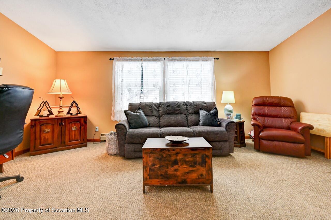 1317 Heart Lake Road Scott Township, PA 18433 - Photo 14 of 60 a living room with furniture and a window