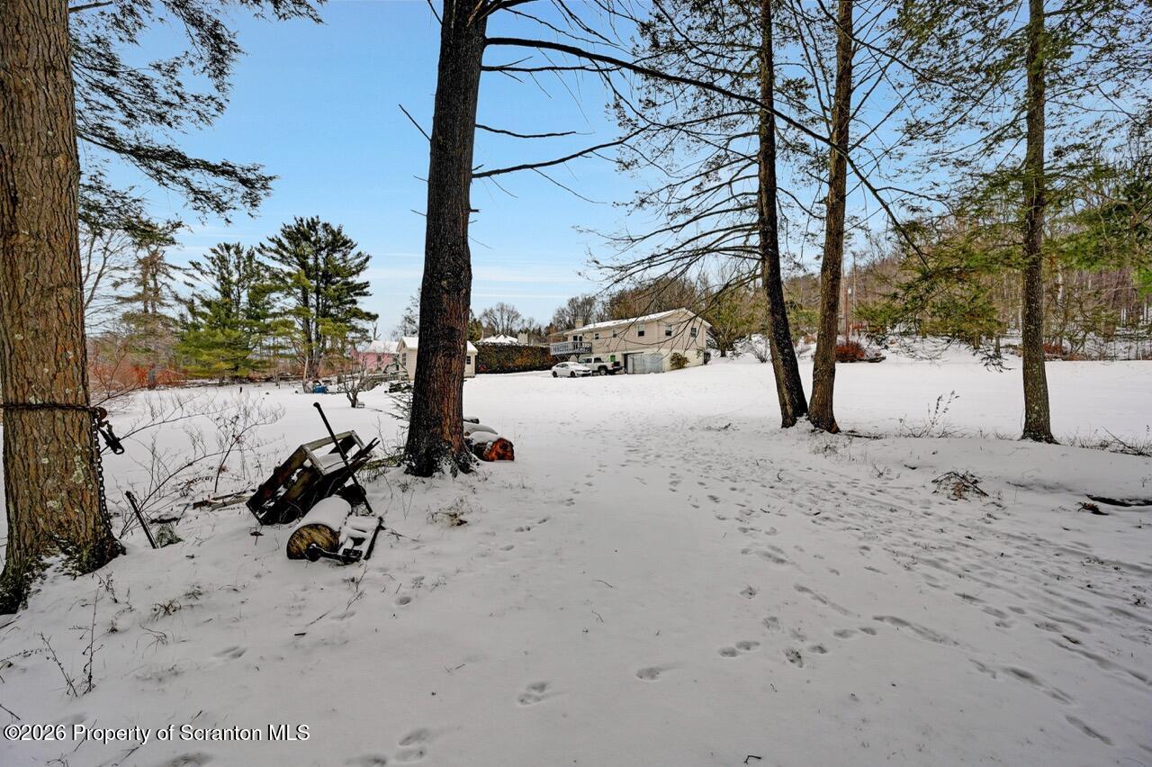 1317 Heart Lake Road Scott Township, PA 18433 - Photo 3 of 60 a view of a road with snow on the road