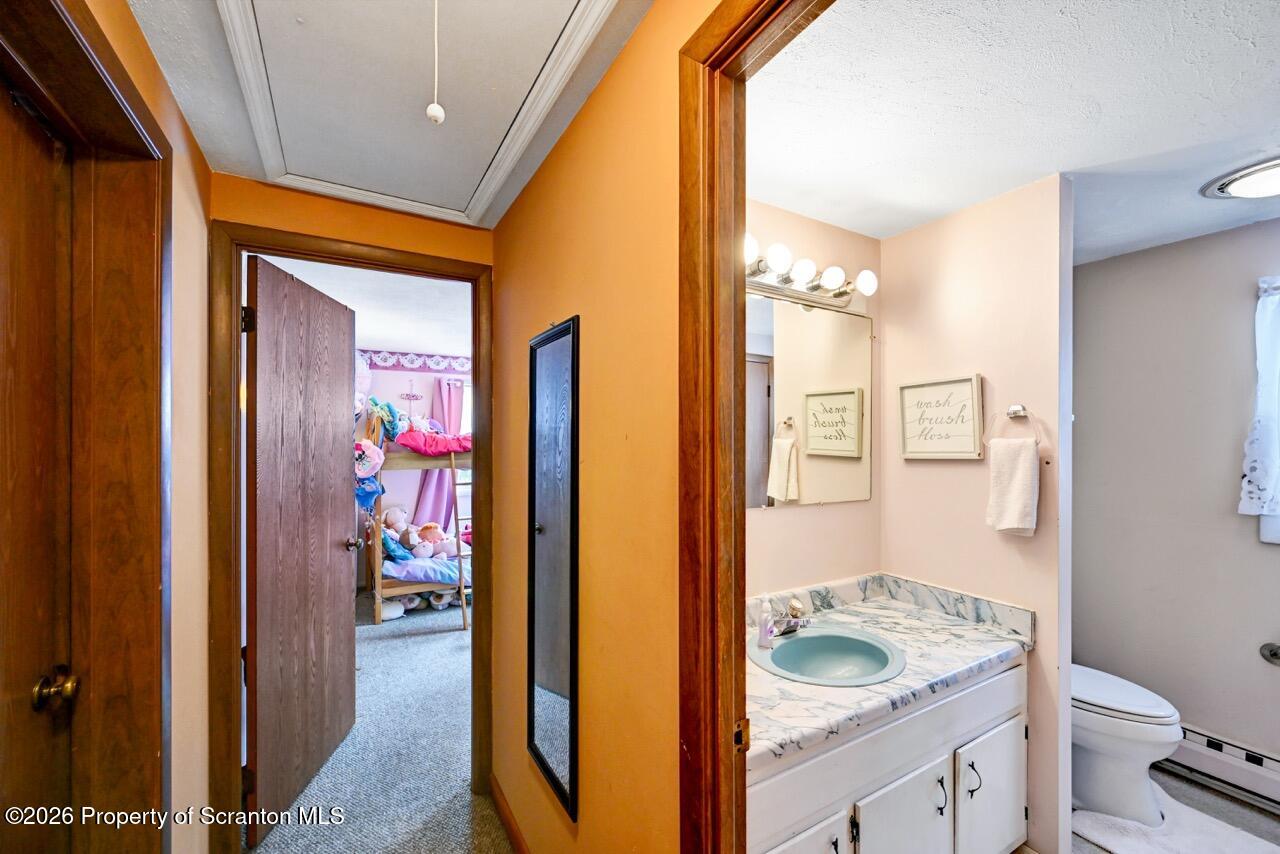 1317 Heart Lake Road Scott Township, PA 18433 - Photo 49 of 60 a bathroom with a granite countertop sink and a mirror