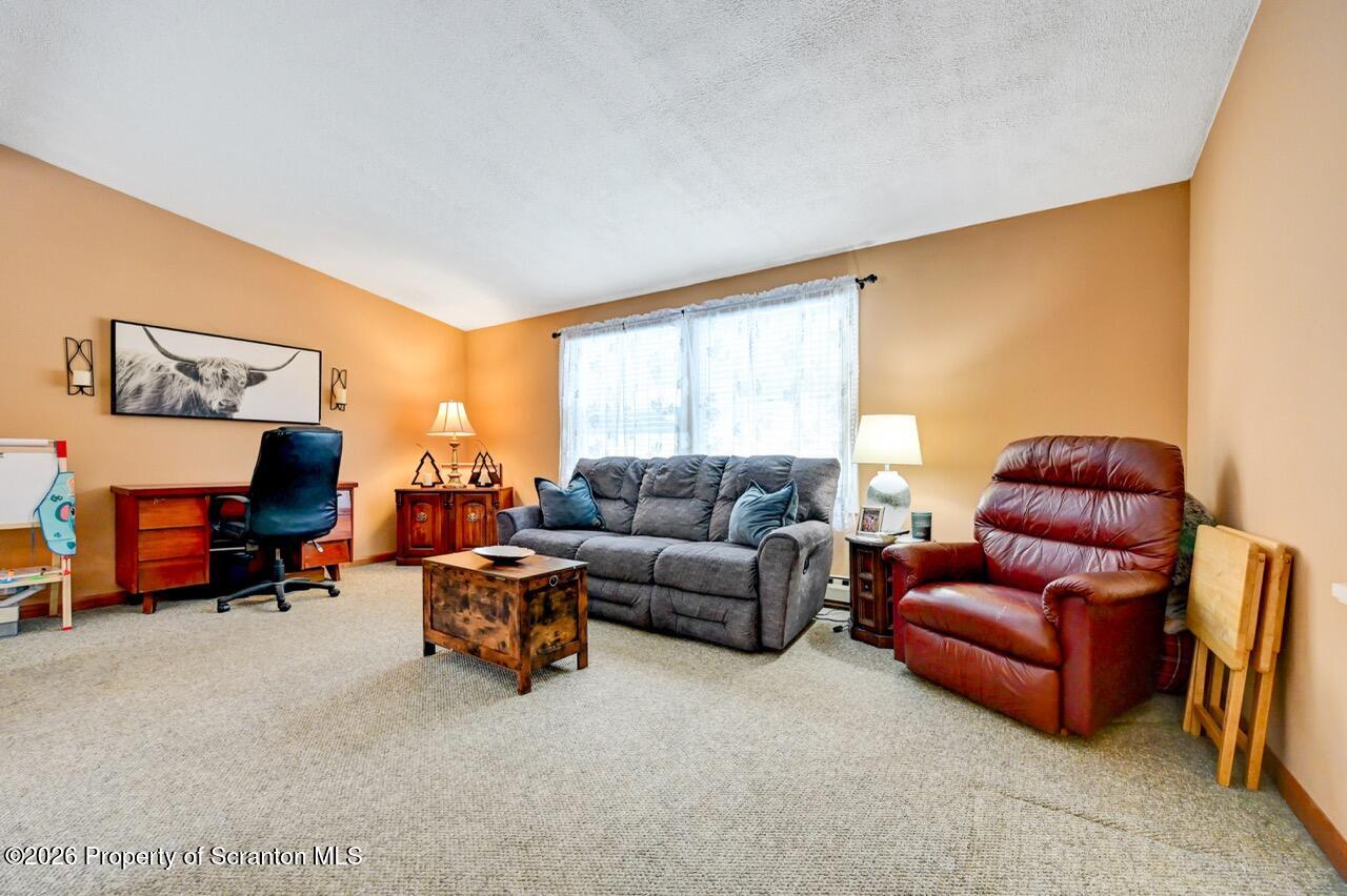 1317 Heart Lake Road Scott Township, PA 18433 - Photo 10 of 60 a living room with furniture and a window