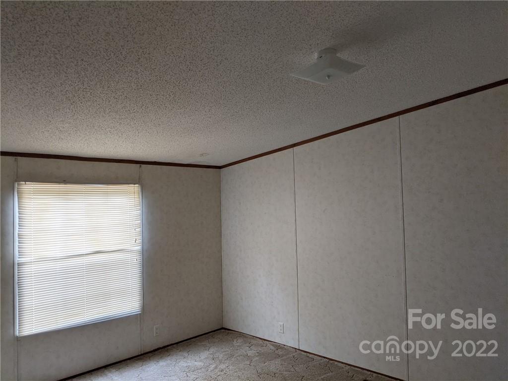 1449 State Rd S-28-313 Cassatt, SC 29032 - Photo 12 of 13 a view of an empty room with a window