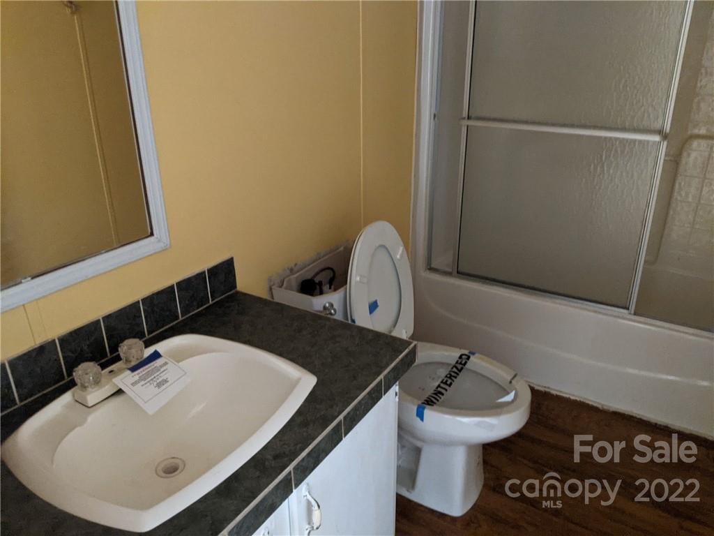 1449 State Rd S-28-313 Cassatt, SC 29032 - Photo 13 of 13 a bathroom with a sink and a toilet