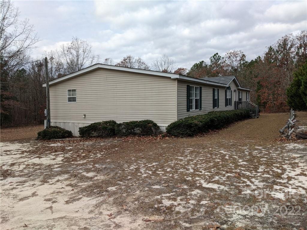 1449 State Rd S-28-313 Cassatt, SC 29032 - Photo 2 of 13 a view of backyard of house