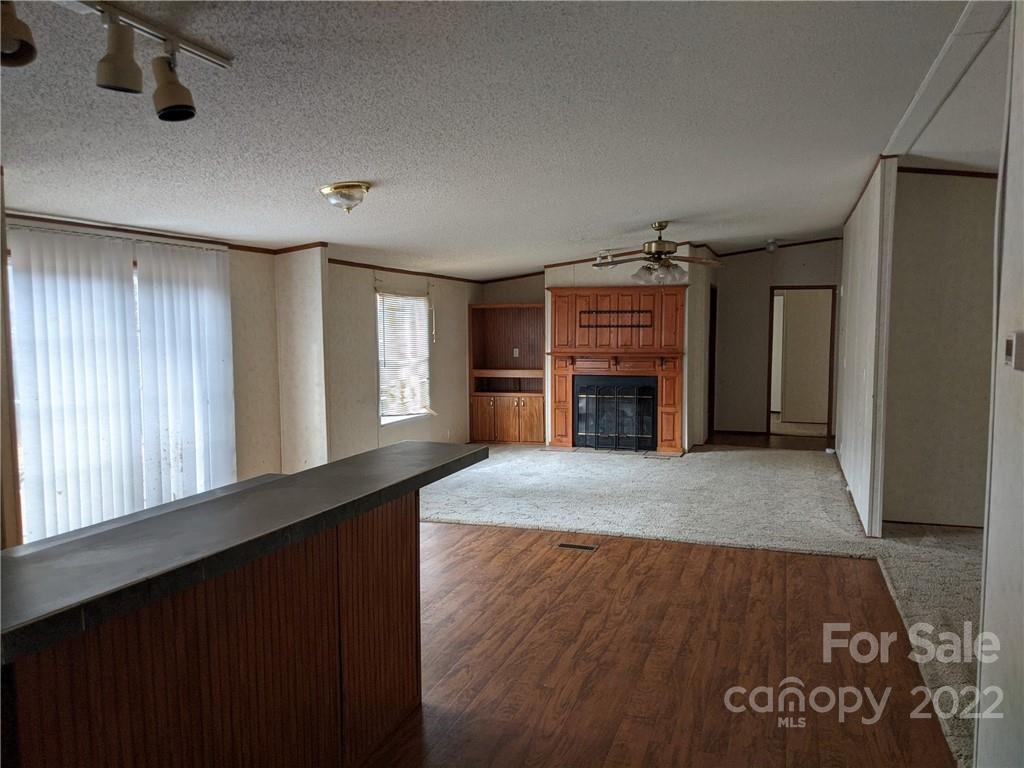 1449 State Rd S-28-313 Cassatt, SC 29032 - Photo 4 of 13 a view of a livingroom with a fireplace