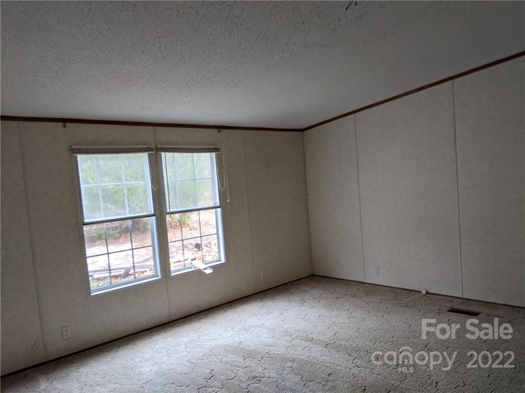 1449 State Rd S-28-313 Cassatt, SC 29032 - Photo 6 of 13 an empty room with a window