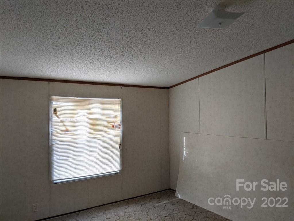 1449 State Rd S-28-313 Cassatt, SC 29032 - Photo 10 of 13 a view of an empty room with a window