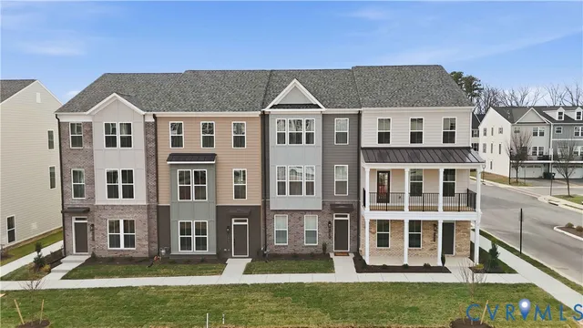 a front view of a residential houses with yard