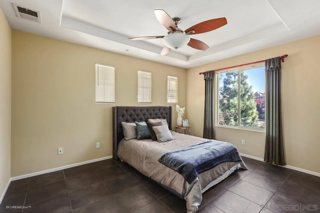1685 Avery Road San Marcos, CA 92078 - Photo 13 of 26 a bedroom with a large bed and a large window