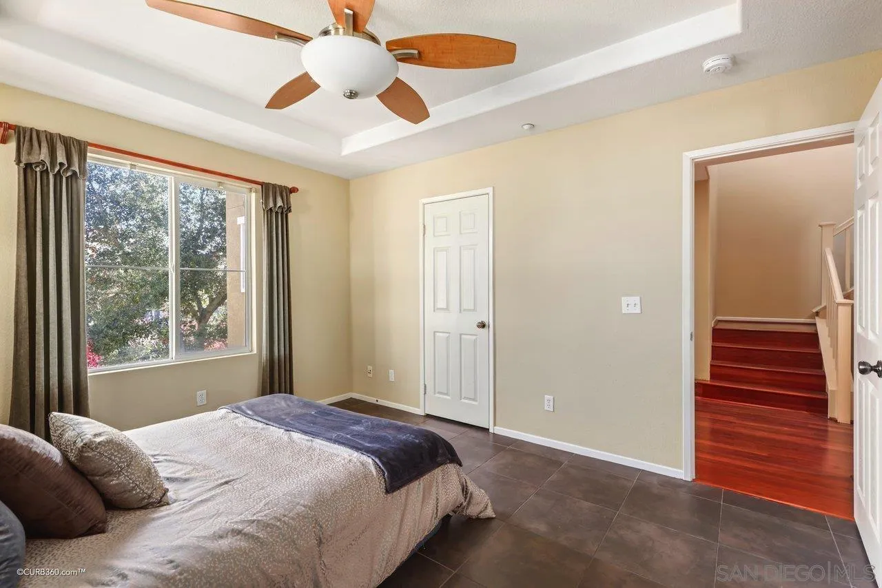 1685 Avery Road San Marcos, CA 92078 - Photo 14 of 26 a bedroom with a bed and a large window with outer view