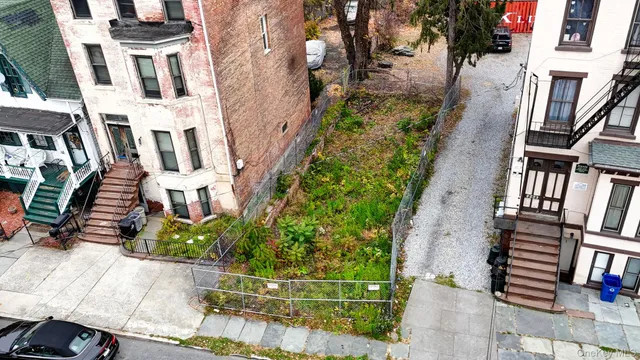 an aerial view of residential houses with stairs