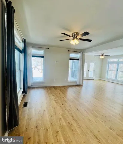 a kitchen with granite countertop a refrigerator and a stove