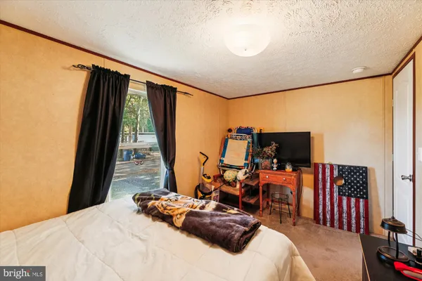 a bedroom with furniture and a bed