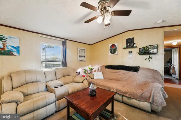 a bedroom with furniture and a large window