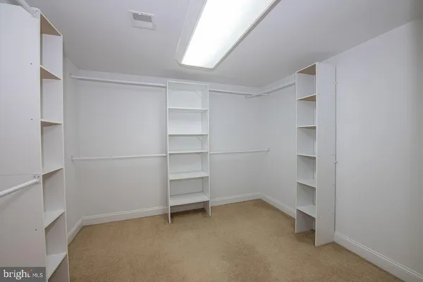 a view of an empty walk in closet