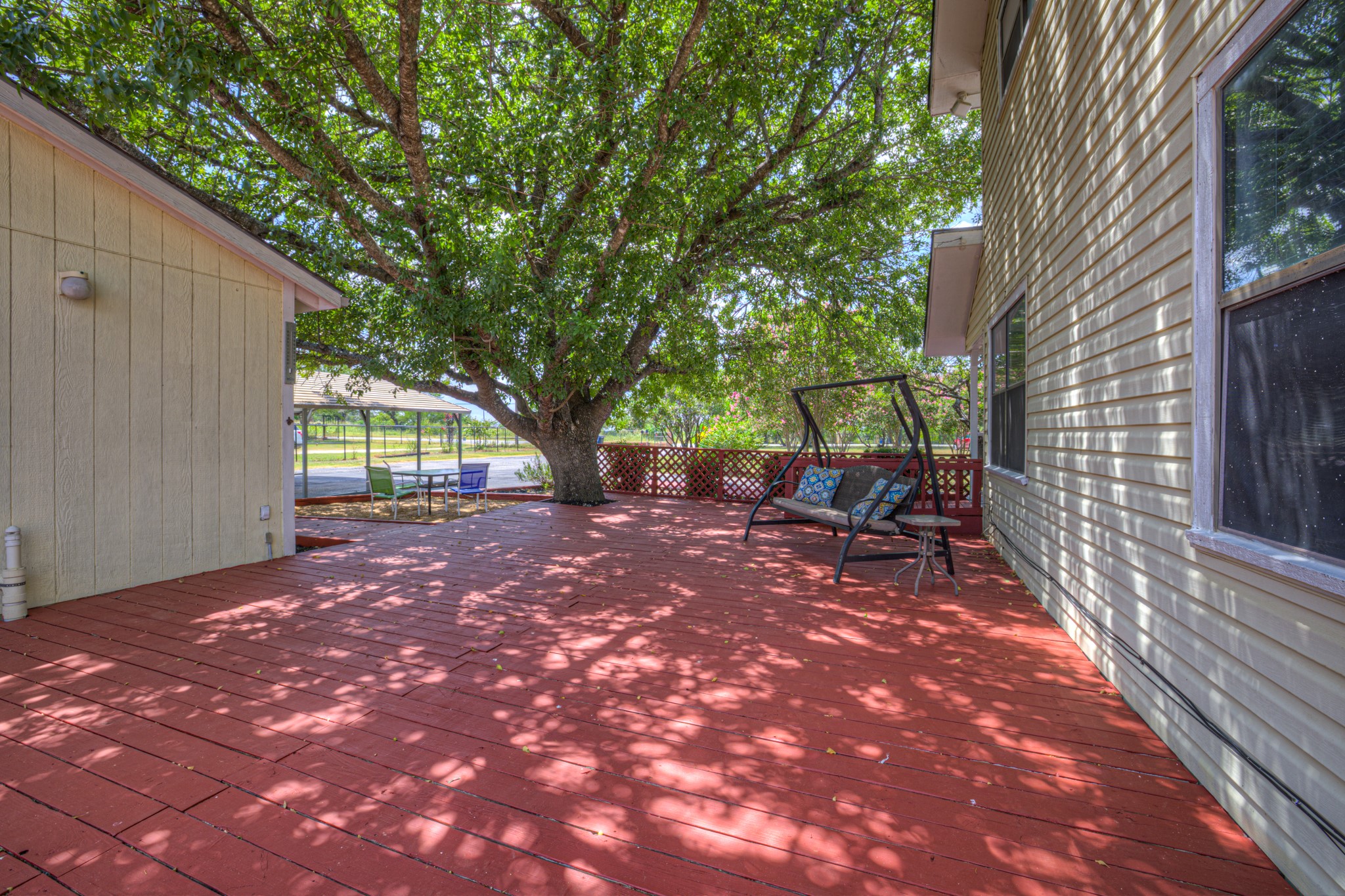580 East Zipp Road New Braunfels, TX 78130 - Photo 24 of 45 Massive Deck withe the most beautiful oak tree to give shade as well.