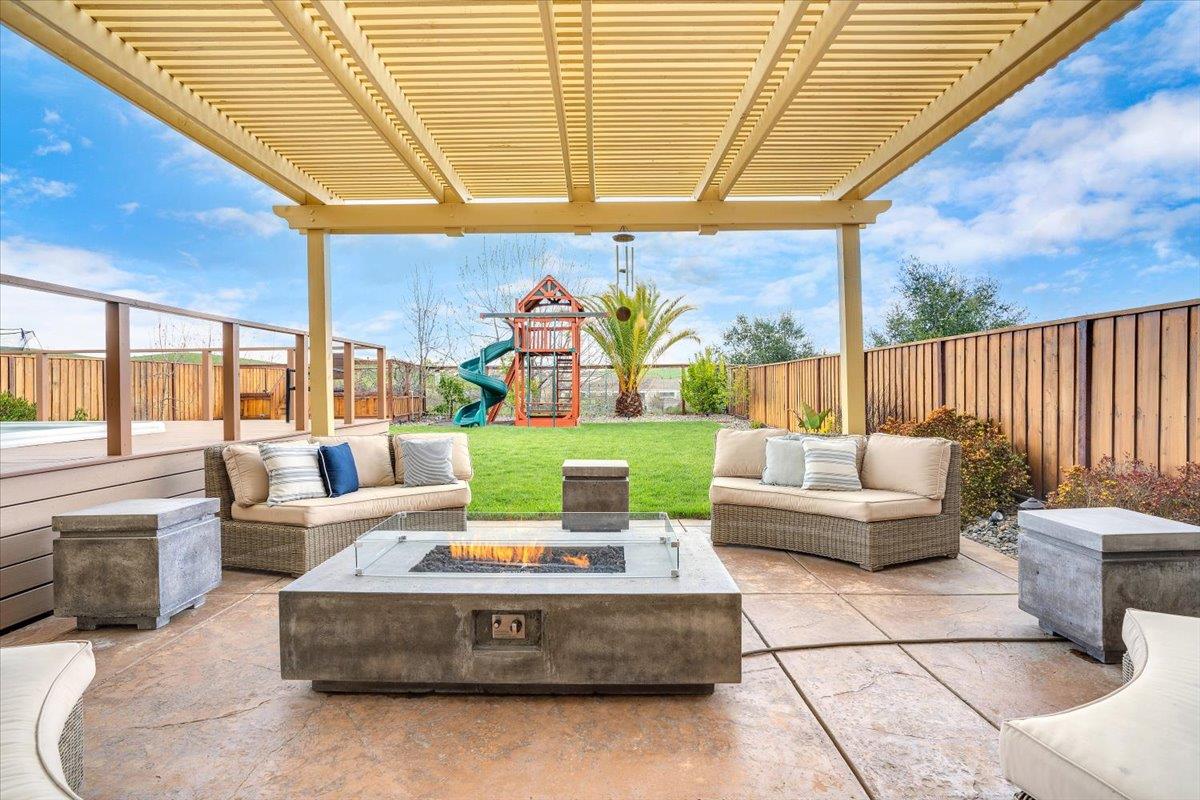 a outdoor living space with patio furniture and garden view