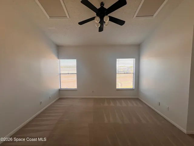 a view of empty room with windows
