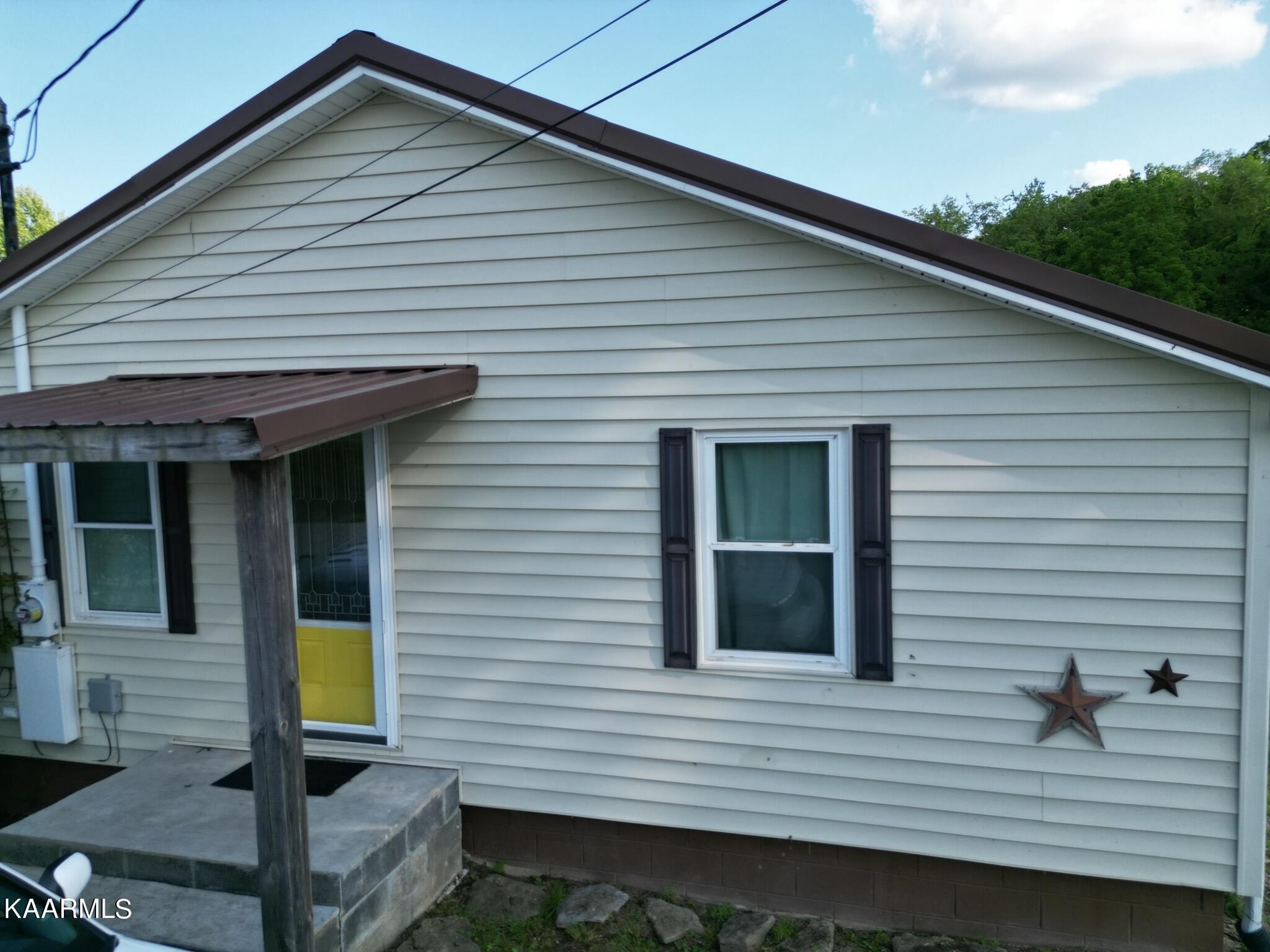 609 Bryan Road Rutledge, TN 37861 - Photo 1 of 47 a view of house with backyard and glass windows