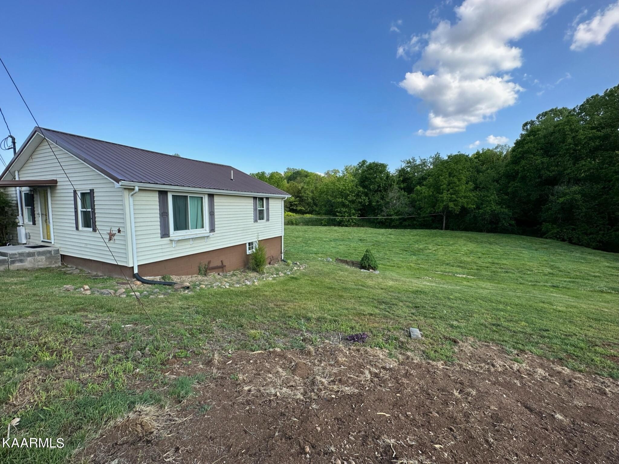 609 Bryan Road Rutledge, TN 37861 - Photo 4 of 47 a view of a house with a backyard