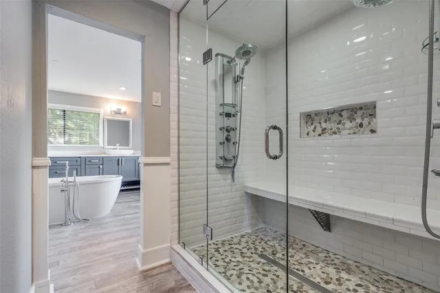 a view of an empty room and wooden floor