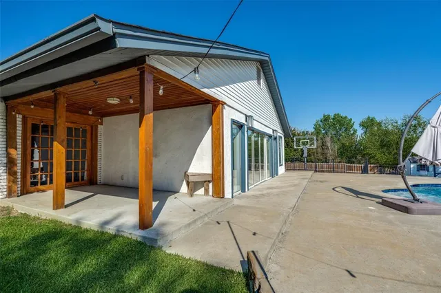 a view of swimming pool with a patio