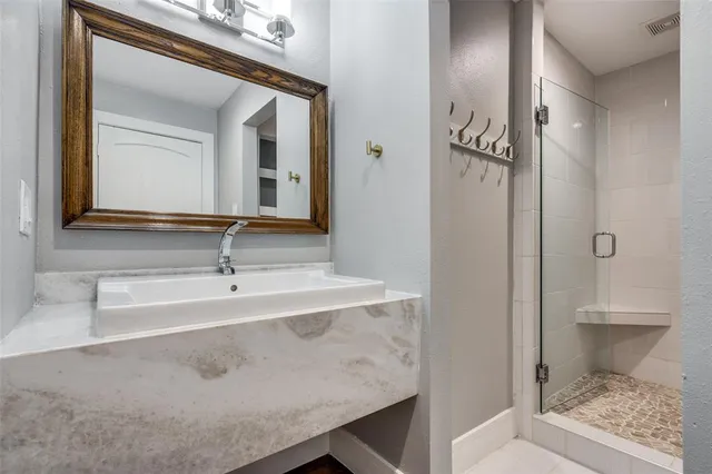a white toilet sitting next to a bathroom sink