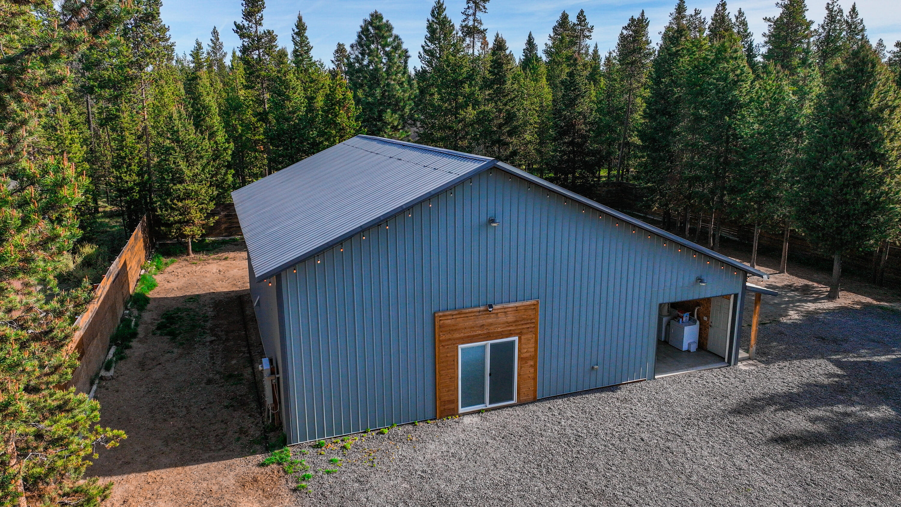 17140 Fontana Road Bend, OR 97707 - Photo 2 of 22 a backyard of a house with wooden fence and large trees