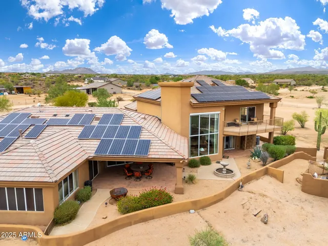 a kitchen with a table chairs refrigerator and cabinets