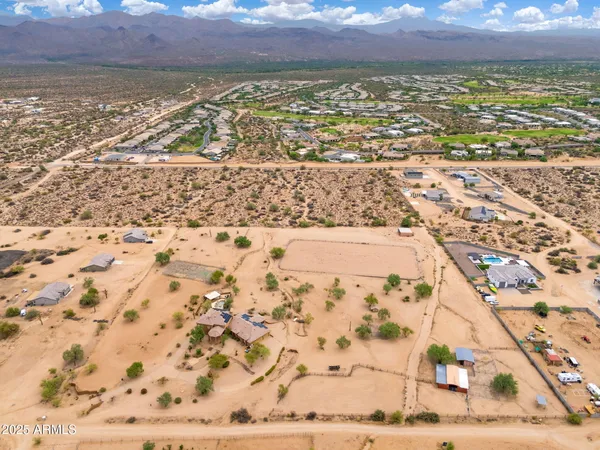 a kitchen with stainless steel appliances granite countertop a stove a refrigerator and a sink