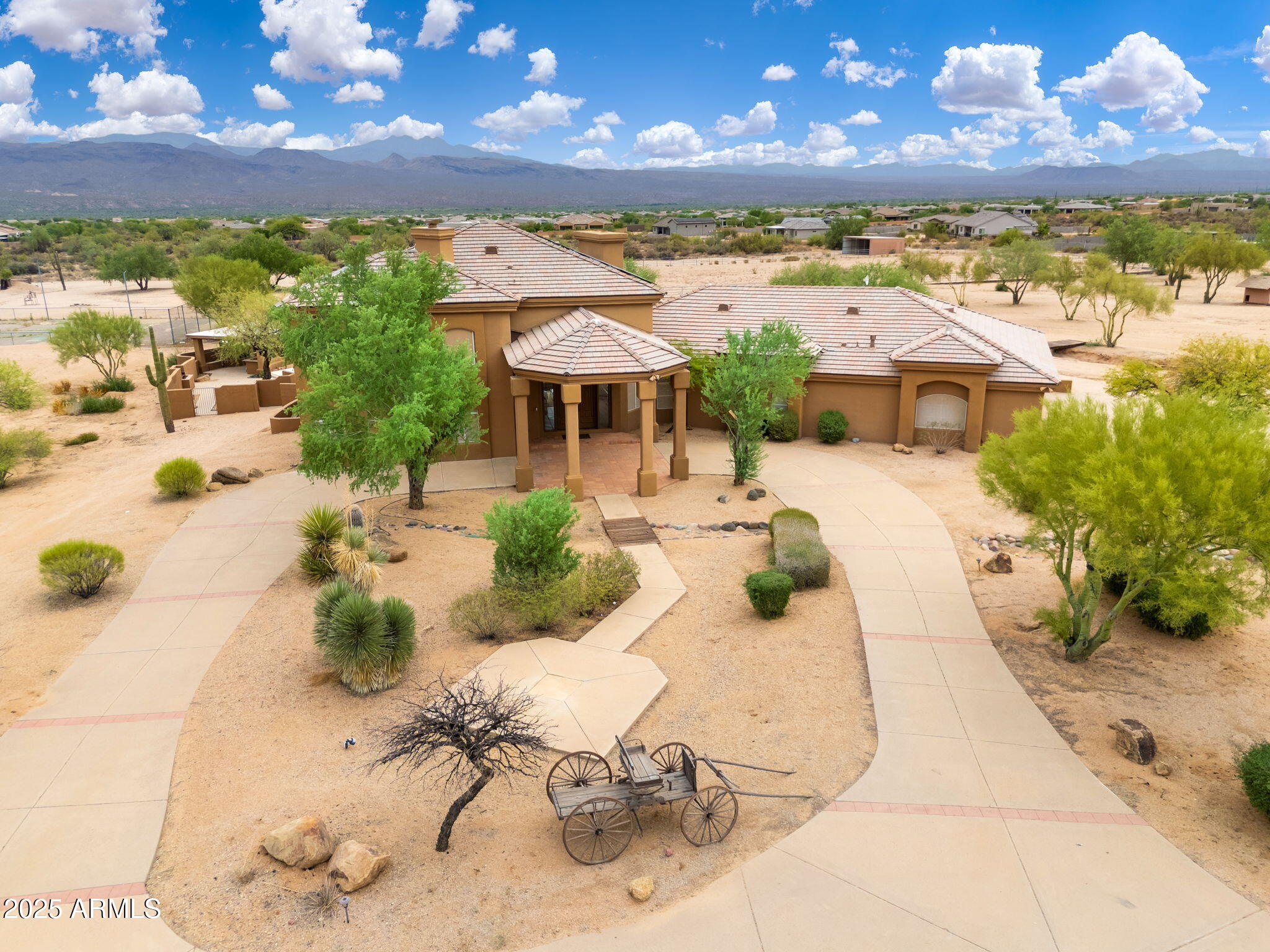 17047 East Dixileta Drive Rio Verde, AZ 85263 - Photo 2 of 115 a view of a swimming pool with a table under an umbrella