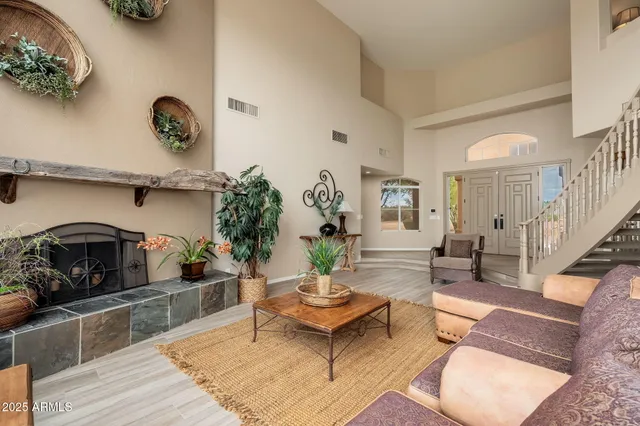 a bathroom with a glass shower door and a window