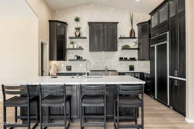 a view of a livingroom with furniture and a potted plant