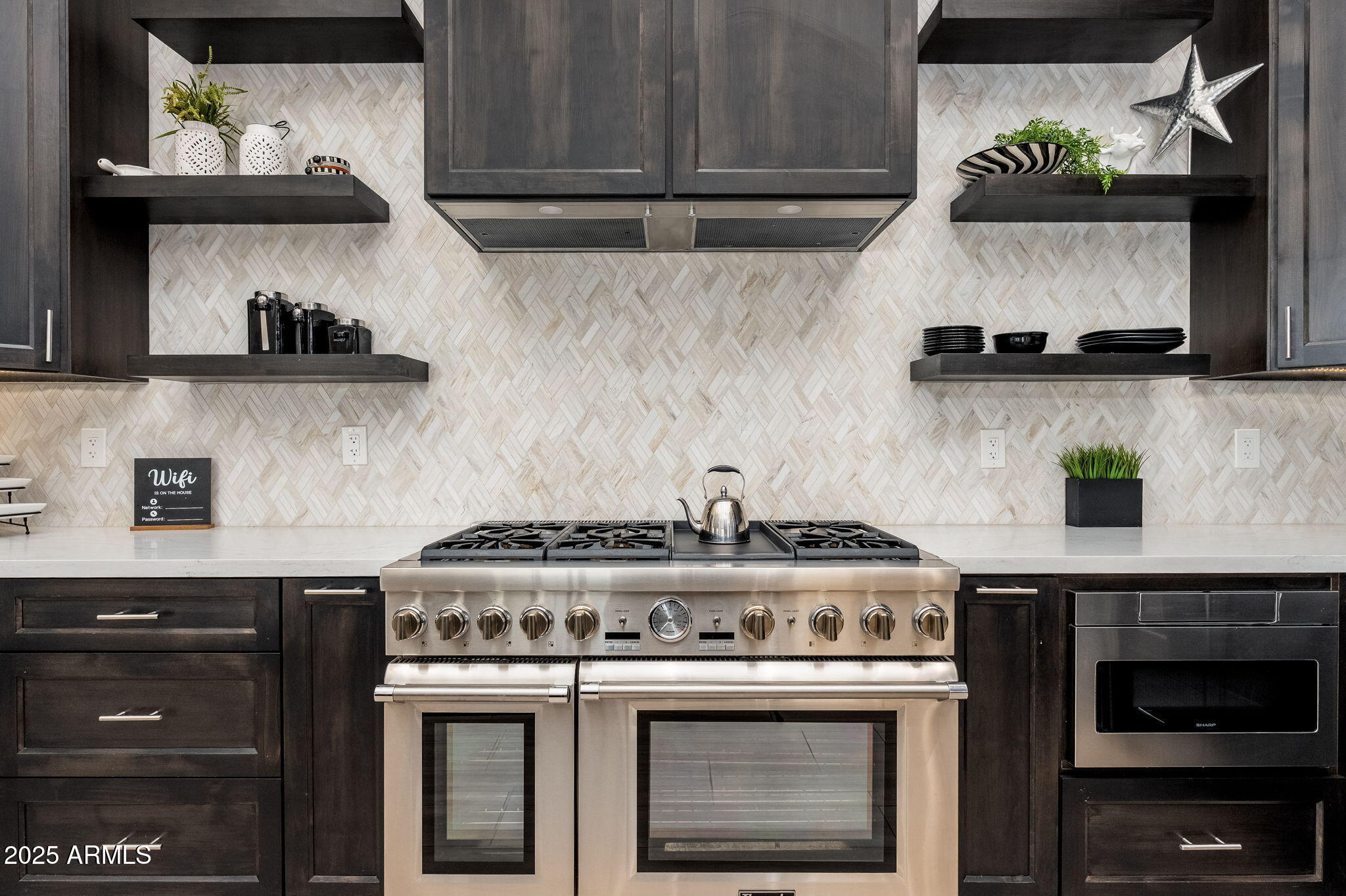 17047 East Dixileta Drive Rio Verde, AZ 85263 - Photo 37 of 115 a stove top oven sitting inside of a kitchen