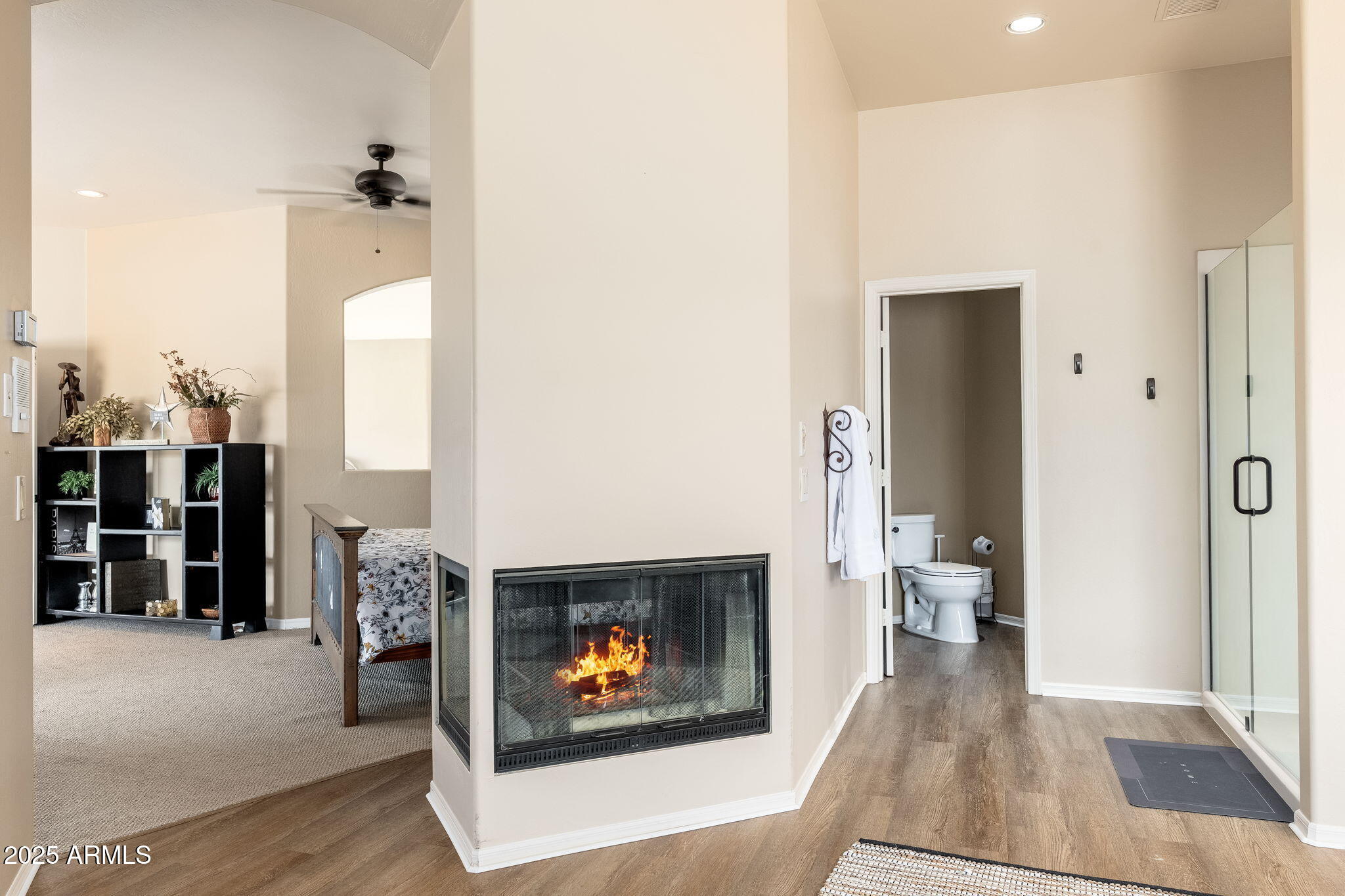 17047 East Dixileta Drive Rio Verde, AZ 85263 - Photo 52 of 115 a living room with furniture and a fireplace