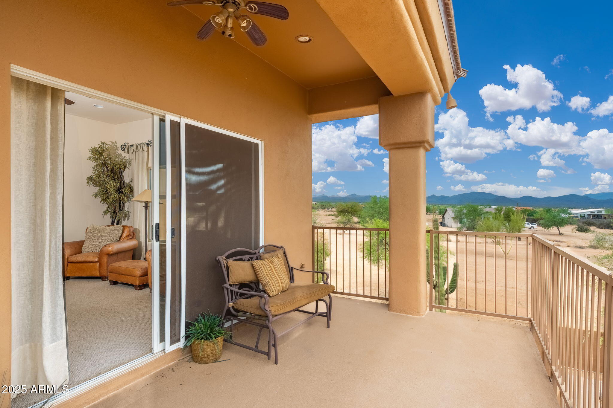 17047 East Dixileta Drive Rio Verde, AZ 85263 - Photo 55 of 115 a view of a balcony with furniture and floor to ceiling window