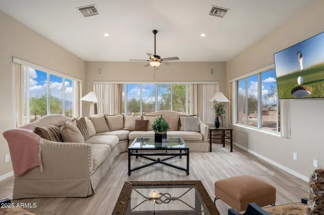 a view of a patio with a dining table and chairs