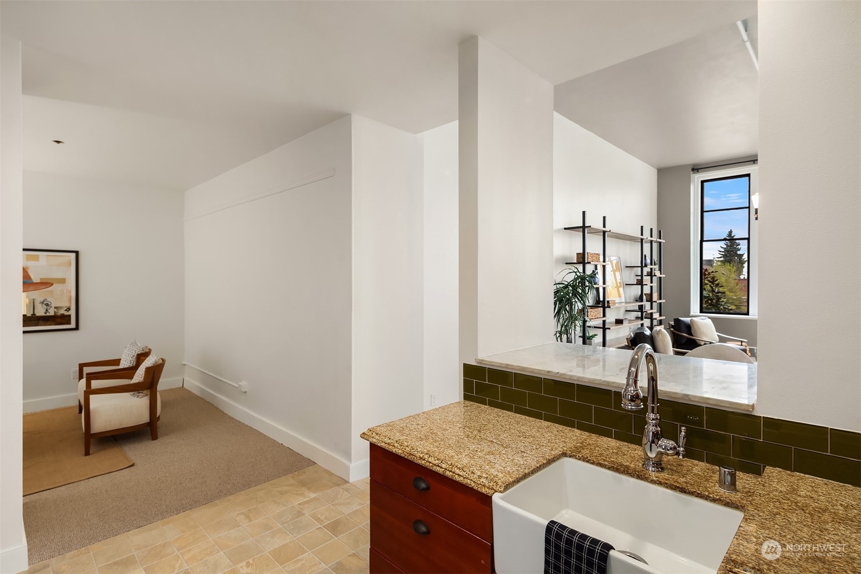 201 Galer Street, Unit 412 Seattle, WA 98109 - Photo 12 of 34 a kitchen with a sink and cabinets