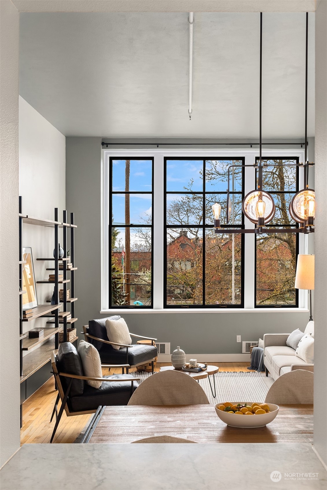 201 Galer Street, Unit 412 Seattle, WA 98109 - Photo 15 of 34 a living room with furniture and floor to ceiling windows