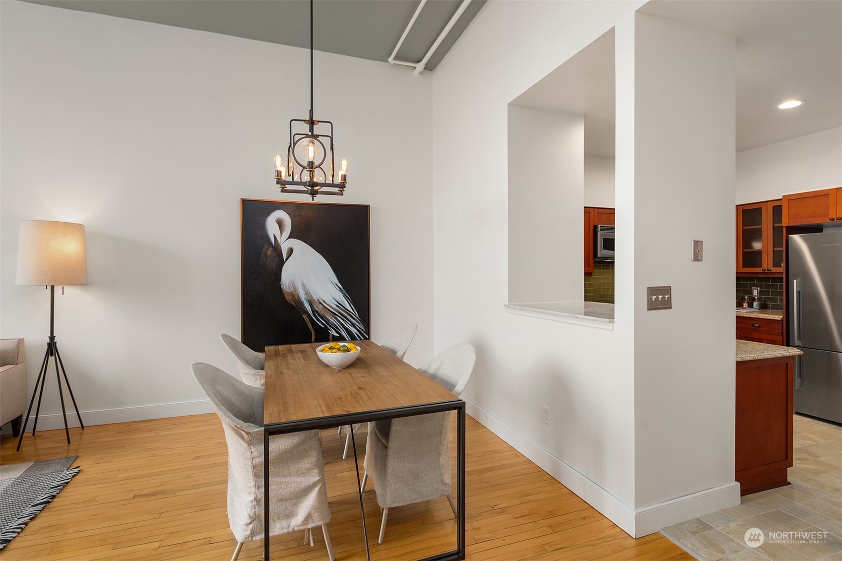201 Galer Street, Unit 412 Seattle, WA 98109 - Photo 16 of 34 a view of a hallway with furniture and wooden floor