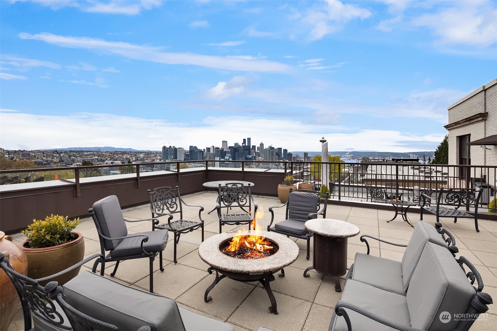 201 Galer Street, Unit 412 Seattle, WA 98109 - Photo 29 of 34 a view of a chairs and table in a terrace