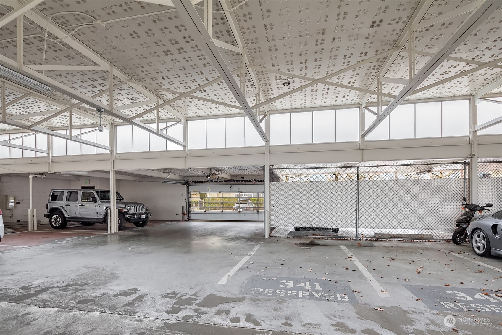 201 Galer Street, Unit 412 Seattle, WA 98109 - Photo 32 of 34 a view of parking garage with cars